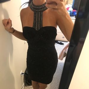Black cocktail dress. Crystal halter piece.